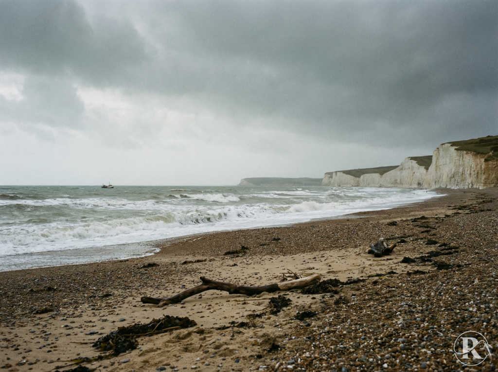South Coast cod - empty winter shoreline with boat on horizon