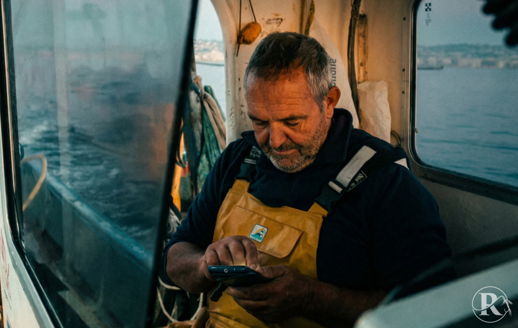 Reelzy charter bookings - skipper checking the Reelzy.co app