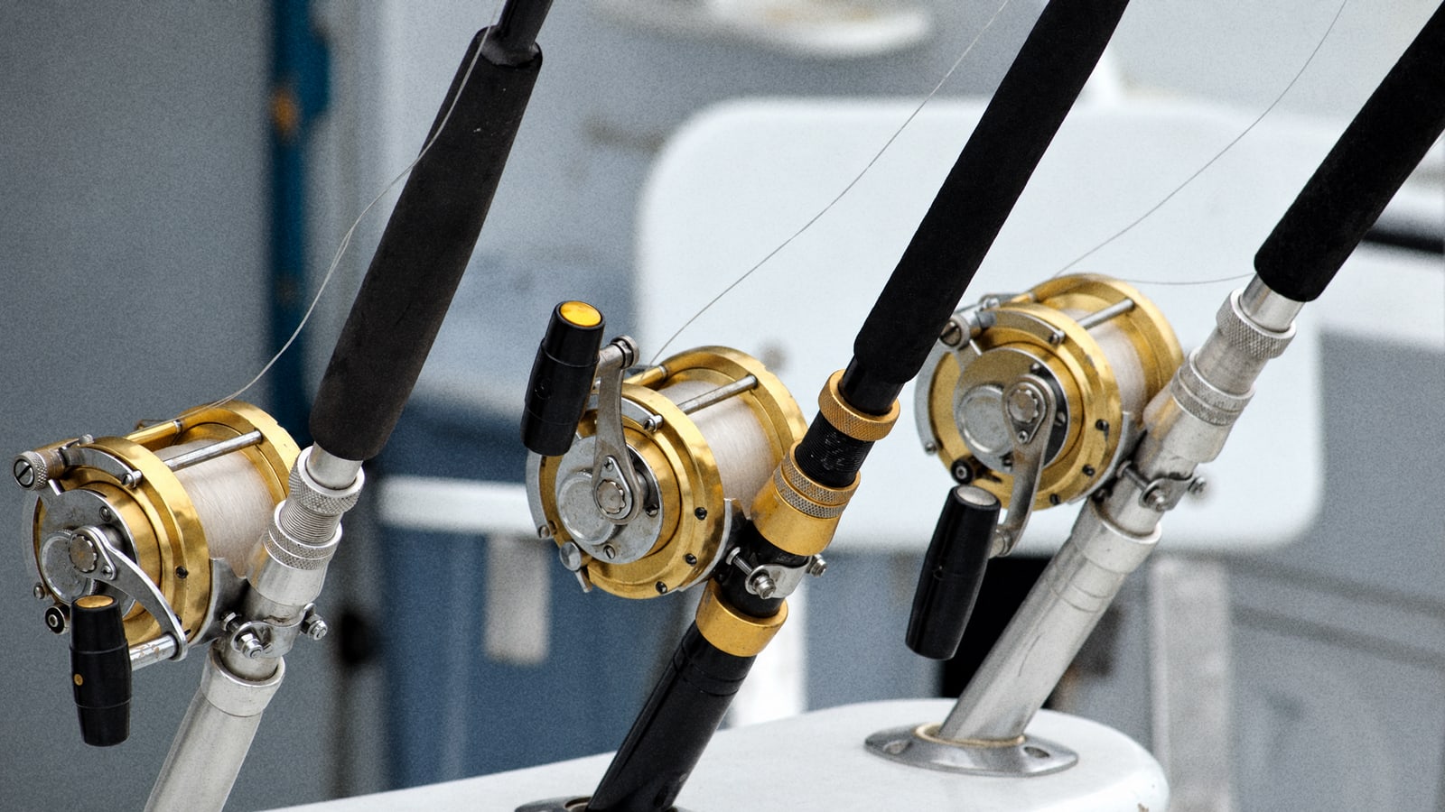 A big game fishing boat trolling off the coast of Mauritius in November, rods set in the stern holders